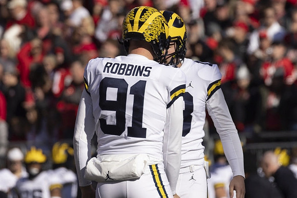 Brad Robbins (91) and Jake Moody (13)