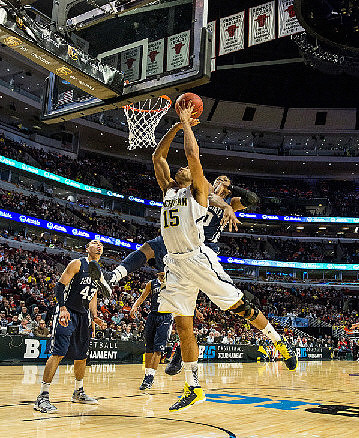 Mitch McGary (4) and Caris LeVert (23)
