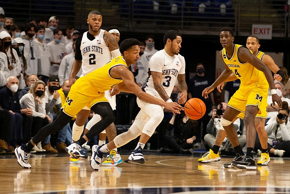 Kobe Bufkin (2), Moussa Diabate (14), and DeVante' Jones (12)