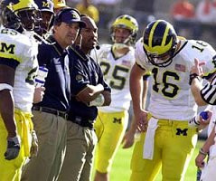 Chris Perry (23), Lloyd Carr, Fred Jackson, Erik Campbell, John Navarre (16), and Hayden Epstein (25