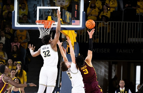 Tarris Reed Jr. (32) and Will Tschetter (42)