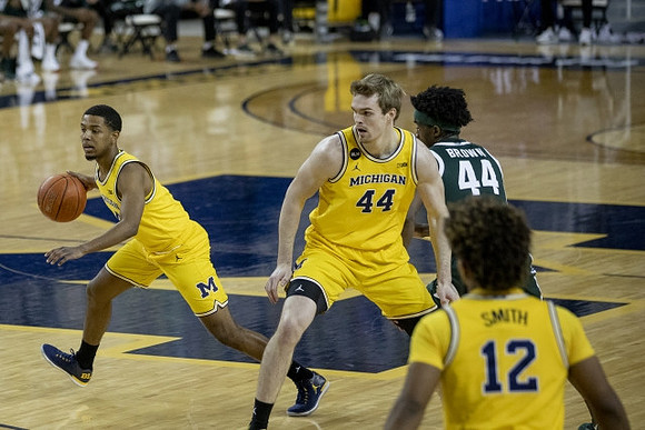 Rico Ozuna-Harrison (14), Jaron Faulds (44), and Mike Smith (12)