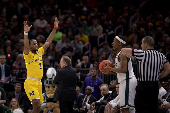 Zavier Simpson (3) and Michigan State Head Coach Tom Izzo