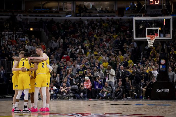 Ignas Brazdeikis (13), Charles Matthews (1), Zavier Simpson (3), Jordan Poole (2), and Jon Teske (15)