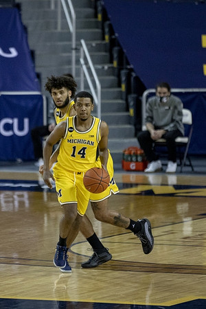 Rico Ozuna-Harrison (14) and Isaiah Livers (2)
