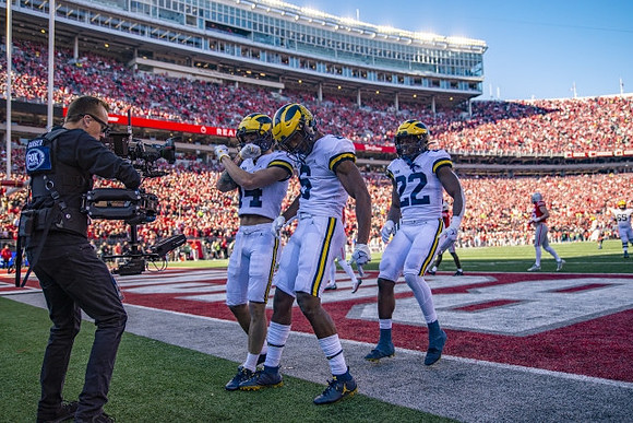 Roman Wilson (14), Cornelius Johnson (6), and Tavierre Dunlap (22)