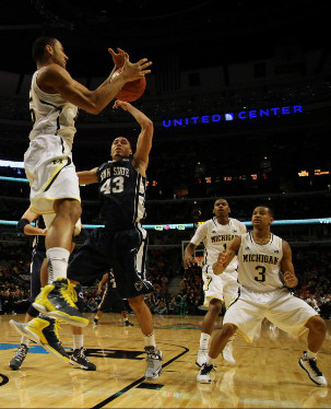 Jon Horford (15), Glenn Robinson III (1), and Trey Burke (3)