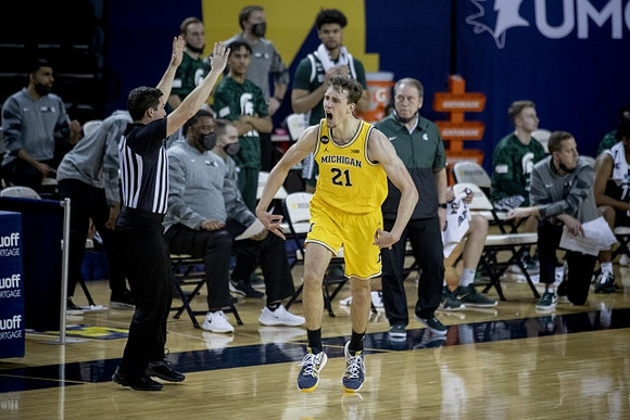 Franz Wagner (21) and Michigan State Head Coach Tom Izzo