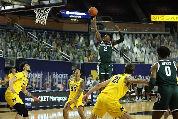 Brandon Johns Jr. (23), Eli Brooks (55), and Franz Wagner (21)