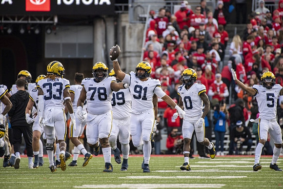 German Green (33), Kenneth Grant (78), Cam Goode (99), Taylor Upshaw (91), Mike Sainristil (0), and DJ Turner (5)