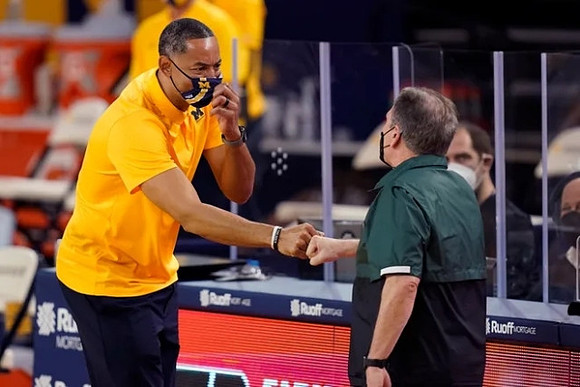 Juwan Howard and Michigan State Head Coach Tom Izzo