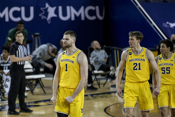 Hunter Dickinson (1), Franz Wagner (21), and Eli Brooks (55)