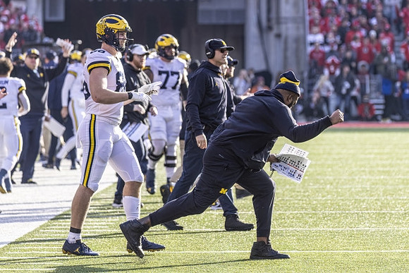 Luke Schoonmaker (86), Trevor Keegan (77), and Jim Harbaugh