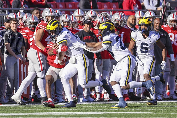 J.J. McCarthy (9), CJ Stokes (23), and Cornelius Johnson (6)