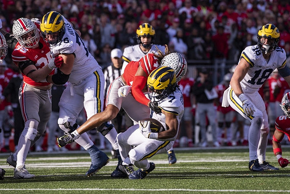 Ryan Hayes (76), J.J. McCarthy (9), Donovan Edwards (7), and Colston Loveland (18)