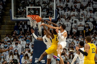 Moussa Diabate (14) and DeVante' Jones (12)