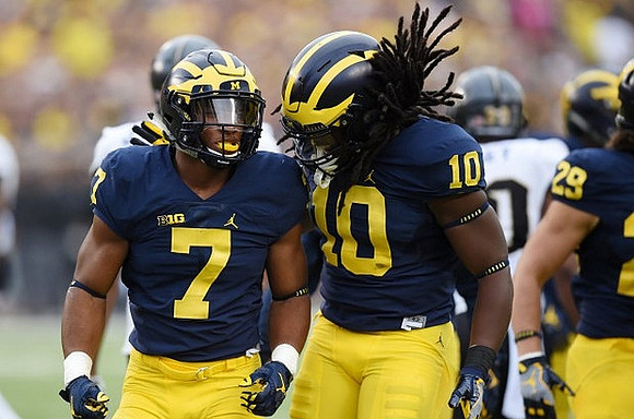 Khaleke Hudson (7) and Devin Bush (10)