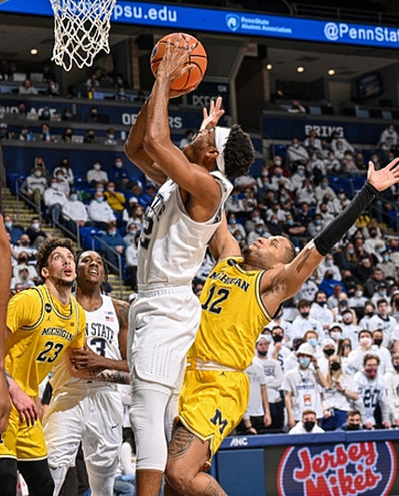 Brandon Johns Jr. (23) and DeVante' Jones (12)