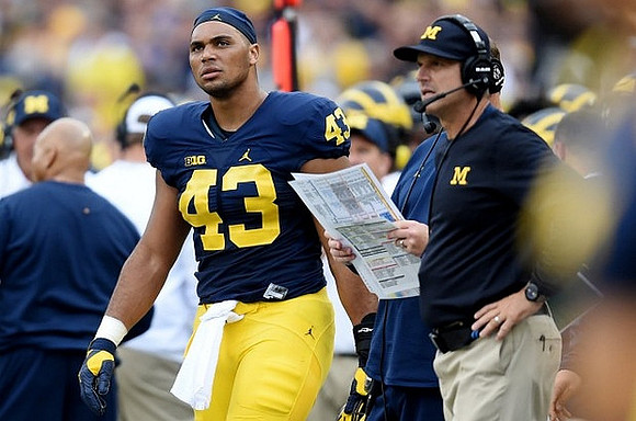 Chris Wormley (43) and Jim Harbaugh