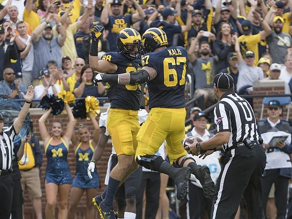 Jake Butt (88) and Kyle Kalis (67)