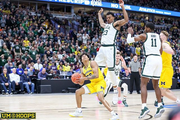 Eli Brooks (55) and Ignas Brazdeikis (13)