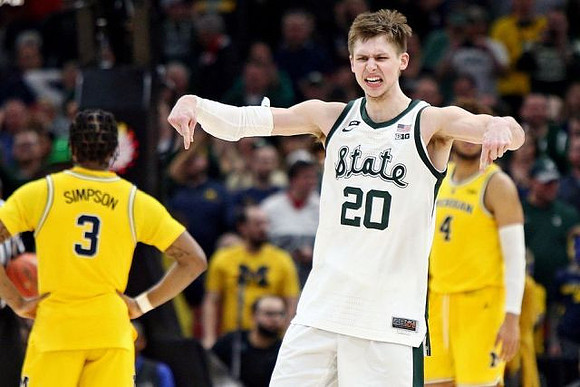 Zavier Simpson (3) and Isaiah Livers (4)