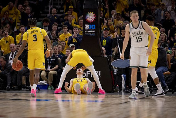 Zavier Simpson (3), Jordan Poole (2), Ignas Brazdeikis (13), and Charles Matthews (1)