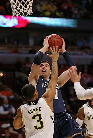 Nik Stauskas (11), Glenn Robinson III (1), and John Beilein