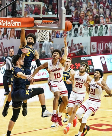 Brandon Johns Jr. (23), Isaiah Livers (2), and Austin Davis (51)