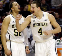 Jordan Morgan (52), Mitch McGary (4), and Nik Stauskas (11)