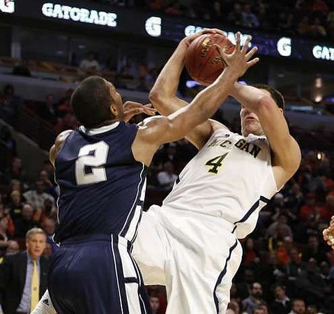 Caris LeVert (23), Tim Hardaway Jr. (10), Glenn Robinson III (1), and Jon Horford (15)