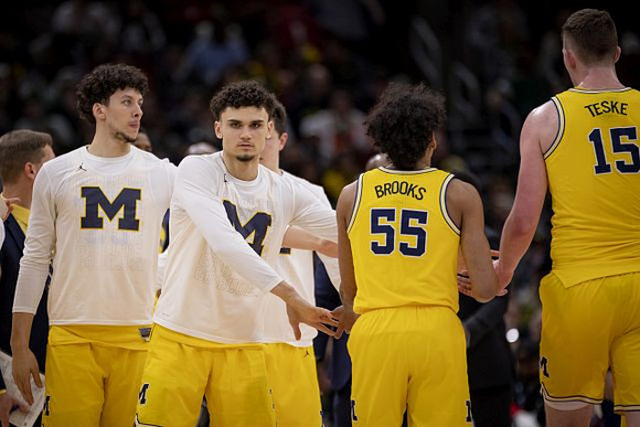 Brandon Johns Jr. (23), Adrien Nunez (5), Eli Brooks (55), and Jon Teske (15)