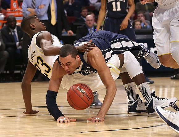 Trey Burke (3), Glenn Robinson III (1), Mitch McGary (4), Jordan Morgan (52), and LaVall Jordan
