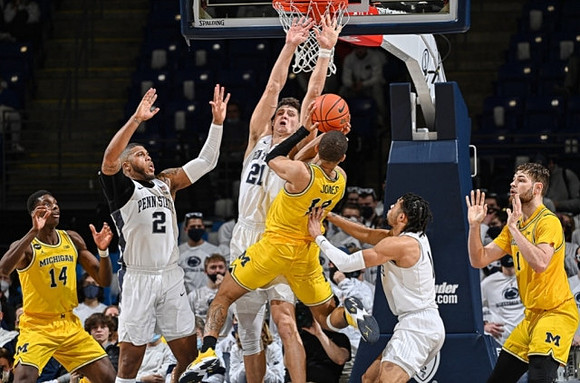 Moussa Diabate (14), DeVante' Jones (12), and Hunter Dickinson (1)