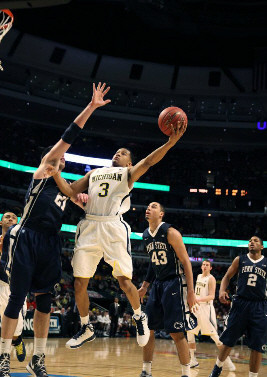 Trey Burke (3) and Nik Stauskas (11)