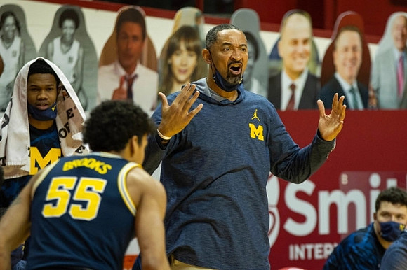 Chaundee Brown Jr. (15), Eli Brooks (55), Juwan Howard, and C.J. Baird (24)
