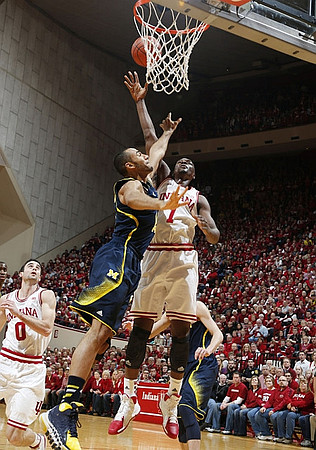 Nik Stauskas (11), Glenn Robinson III (1), and Jon Horford (15)