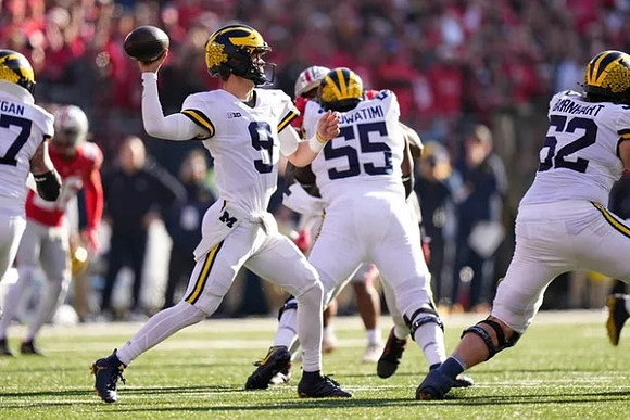 Trevor Keegan (77), J.J. McCarthy (9), Olusegun Oluwatimi (55), and Karsen Barnhart (52)