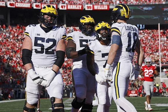 Karsen Barnhart (52), Olusegun Oluwatimi (55), Donovan Edwards (7), and Colston Loveland (18)