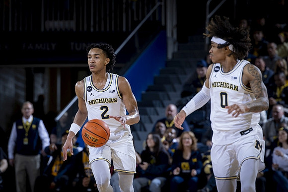 Kobe Bufkin (2) and Dug McDaniel (0)