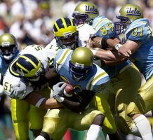 Eric Brackins (51) and Larry Foote (17)