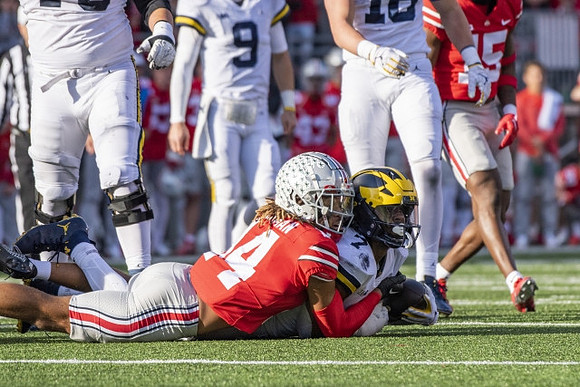 J.J. McCarthy (9) and Donovan Edwards (7)
