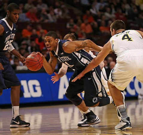 Trey Burke (3) and John Beilein