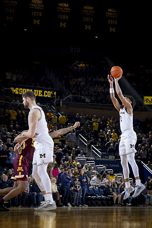 Hunter Dickinson (1) and Kobe Bufkin (2)