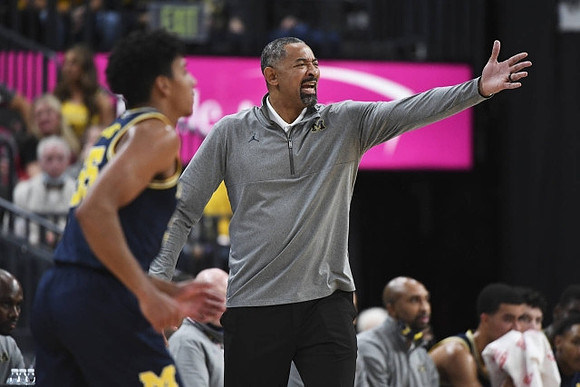 Eli Brooks (55) and Juwan Howard