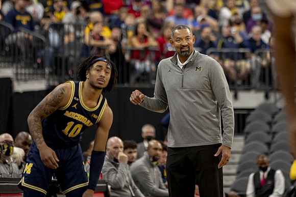 Frankie Collins (10) and Juwan Howard