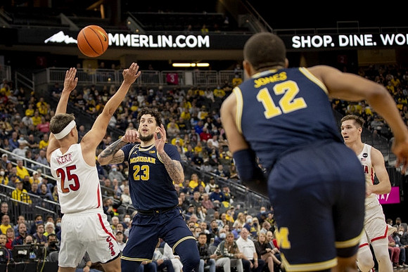 Brandon Johns Jr. (23) and DeVante' Jones (12)