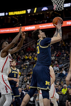 Hunter Dickinson (1) and Brandon Johns Jr. (23)