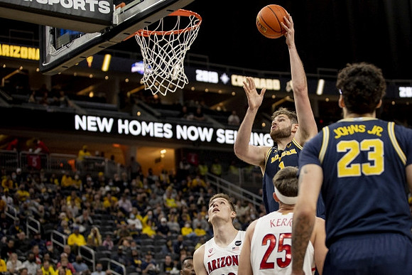 Hunter Dickinson (1) and Brandon Johns Jr. (23)