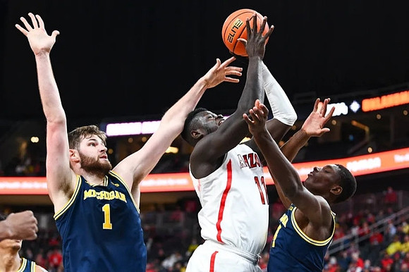 Hunter Dickinson (1) and Moussa Diabate (14)